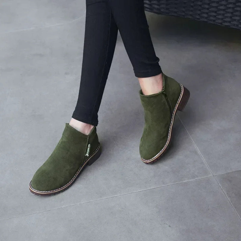 Olive green ankle boots with slim pants
